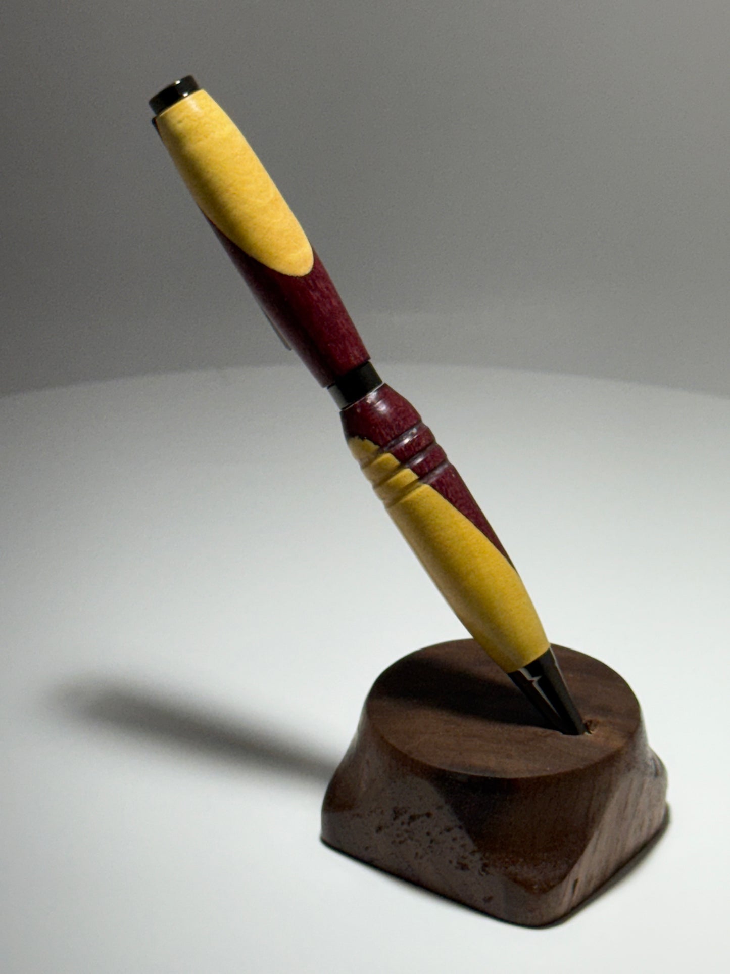 Purpleheart/Yellowheart slimline style twist pen W/gunstock trim