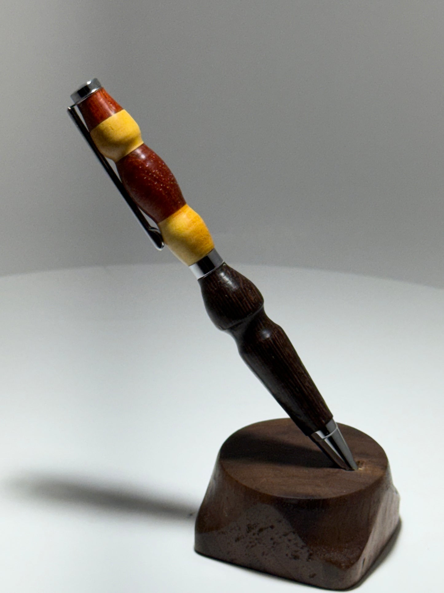 Padauk/yellowheart/Wenge slimline style twist pen w/ silver trim